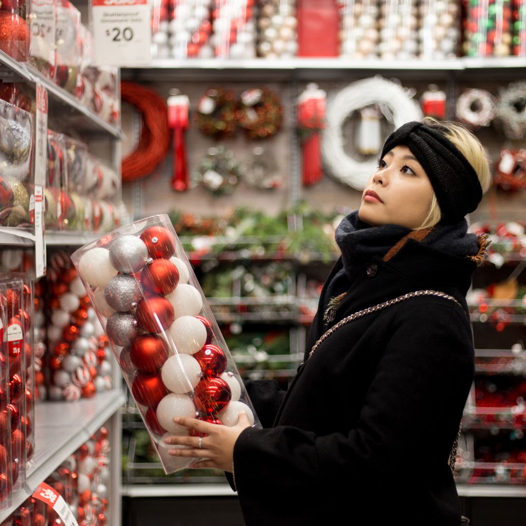 Woman shopping for Christmas decorations in-store